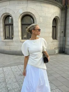 Elegant white slim fit o-neck puff sleeve top, chic summer fashion apparel detail view.
