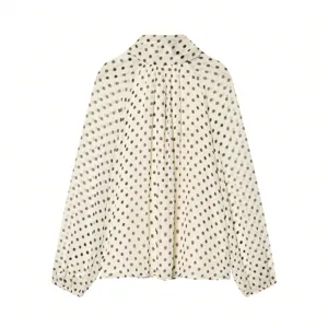 Detailed view of women's long sleeve polka dot blouse casual loose top chiffon shirt.