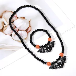 Halloween beaded necklace bracelet set with cute bat pendant, black and orange spooky jewelry.