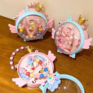 Kids cute unicorn jewelry box detail showing colorful bead bracelets and hair accessories.