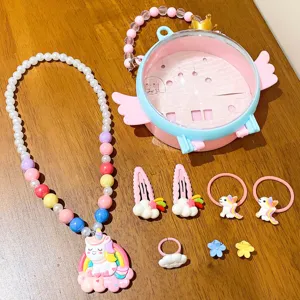 Children unicorn jewelry set detail showcasing cute necklace bracelet hair clips and gift box.