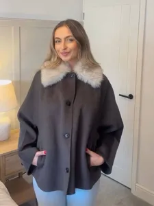 Stylish women winter dark brown coat with plush faux fur lapel, cozy long sleeve outwear.