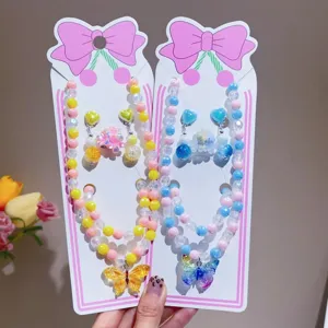 Details of colorful beaded necklace and butterfly pendant set, cute children jewelry accessories.