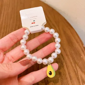 Cute avocado pendant artificial pearl beaded bracelet for women and girls daily wear accessory.