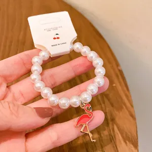 Cute pearl flamingo bracelet for women, sweet style beaded jewelry fashion accessory gift.