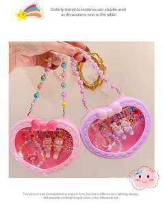Cute heart-shaped children handbag and accessory set detail showcasing beads and cute toys inside.
