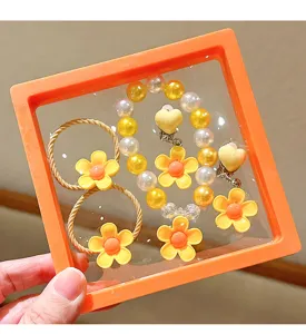 Children cute yellow flower pearl bracelet and hair tie jewelry gift set detail view.