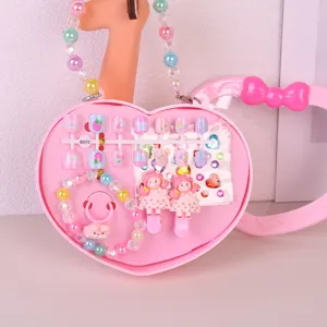 Cute pink heart-shaped children handbag toy set featuring press-on nails, bracelet and hair clips.