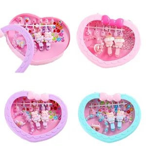 Kids heart-shaped jewelry set with cute hair clips, bracelets, rings, and fake nails for girls.