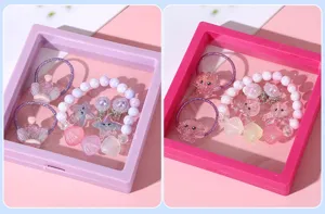 Detail view of kids marine style shell pearl bracelet and hair tie jewelry set display box.