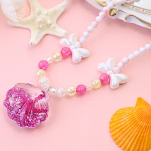 Girls ocean style pearl beaded necklace with glitter shell pendant for children jewelry detail.