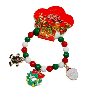 Kids Christmas charm bracelet with colorful beads, cute Santa and gingerbread man pendants.