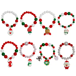 Kids Christmas beaded bracelet set featuring cute cartoon charms like Santa and snowman for girls.