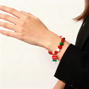 Christmas children beaded bracelet with festive red white green beads and a cute lollipop pendant design.