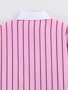 Close-up detail of pink and burgundy vertical striped shirt with contrast white collar.