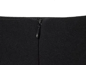 Detailed close-up view of a black women garment zipper and fine fabric craftsmanship.