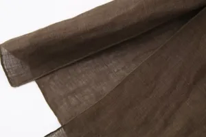Linen fabric detail shot showing fine breathable texture in dark brown color for apparel design.