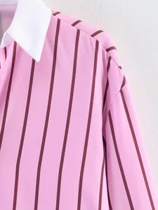 Close-up detail of the pink striped long-sleeve shirt featuring a contrast crisp white collar.