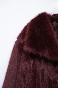 Burgundy faux fur jacket collar detail shot showcasing plush winter outerwear texture.