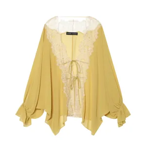 Close-up detail of the elegant lace patchwork chiffon cardigan with V-neck and tie.