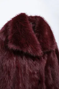 Burgundy faux fur lapel jacket winter warm fuzzy outerwear close up fine detail view.