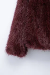 Burgundy faux fur jacket detail shot, soft plush long sleeve winter casual outerwear.
