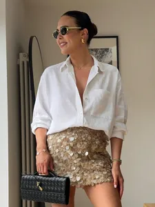 Summer fashion sequin mini skirt for women, elegant slim fit sparkling party apparel.