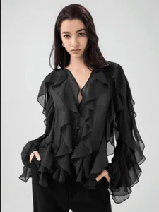 Detail view of the black V-neck chiffon blouse showcasing layered ruffles and elegant long sleeves.