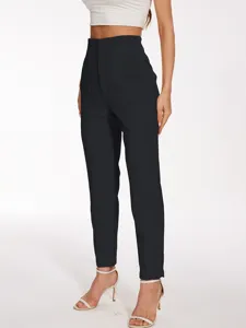 Detailed view of women high waist black casual trousers, elegant tailored suit pants style.