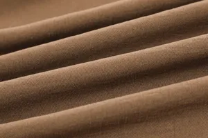Close-up fabric detail showcasing smooth texture, elegant draping, and fine weave quality.