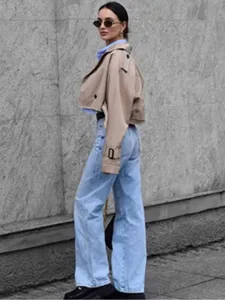 Women's short casual solid color raw edge trench coat for autumn and spring fashion wear.