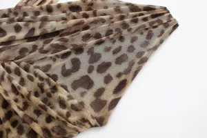 Leopard print mesh fabric detail shot showing texture and ruched tulle design close-up