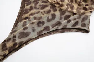 Leopard print mesh fabric detail view, showcasing the fine tulle texture and delicate stitching.