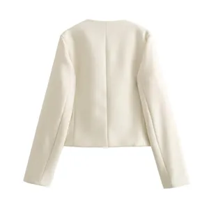 Back view detail of a chic cream white tweed short jacket with round neck design.