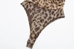 Leopard print mesh fabric detail of slim women bodysuit, lightweight sheer design.