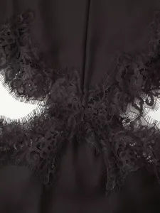 Black lace trim cutout dress detail, elegant satin fabric splice design for women.