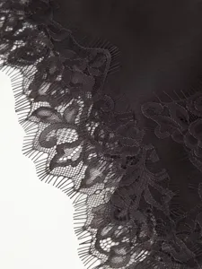 Exquisite black lace trim detail of women fashion splicing dress, elegant autumn style.