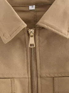 Khaki long sleeve top collar and zipper detail showcasing premium fabric and design.