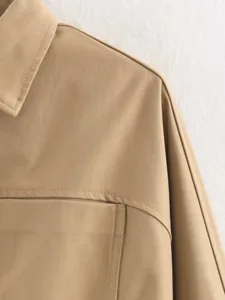 Khaki jacket fabric detail close-up showcasing neat collar stitching and premium twill texture.