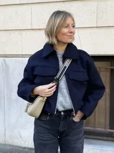 Detail shot of womens navy blue cropped tweed jacket, casual autumn outerwear fashion style.