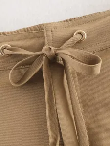 Khaki casual pants detail shot showcasing the stylish drawstring waist and metal eyelets.