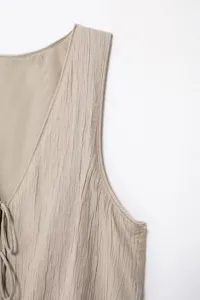 Textured sleeveless vest top detail, light khaki summer basic top, casual V-neck design.