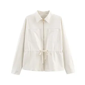 Detail view of women white casual jacket featuring long sleeves and drawstring waist design.