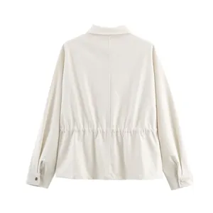 Detail view of women's long sleeve button-up jacket in beige, showing back waist cinch.