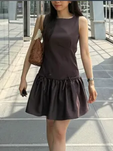 Sleeveless mini dress for women featuring chic bow accents at the drop waist. Perfect style.