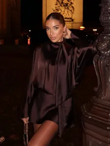 Detail shot of the elegant satin scarf collar long sleeve dress in dark brown finish.