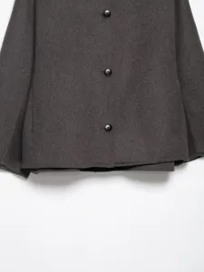 Dark grey wool coat detail showcasing stylish front buttons and soft warm fabric texture.
