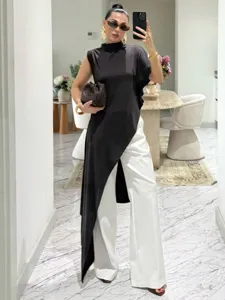 Stylish asymmetrical sleeveless top detail showing elegant draping and modern fashion flair.