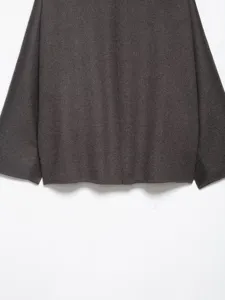 Dark grey woolen coat fabric detail, long sleeve autumn winter warm garment close up view.