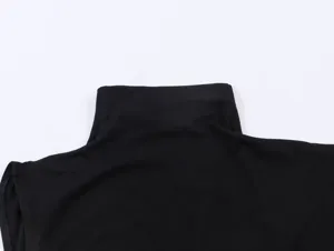 Detail shot of black high neck sleeveless top collar, showing ribbed texture and shoulder cut.